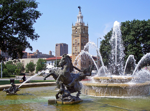 Kansas City is the city of fountains and this photo shows beautiful kansas city fountains with a horse statue and kc buildings in the background